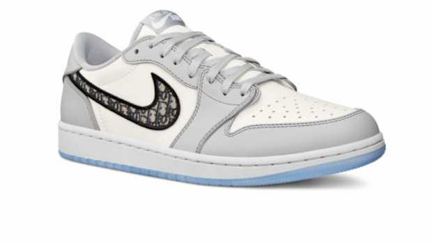 Grey and white Jordan shoe.